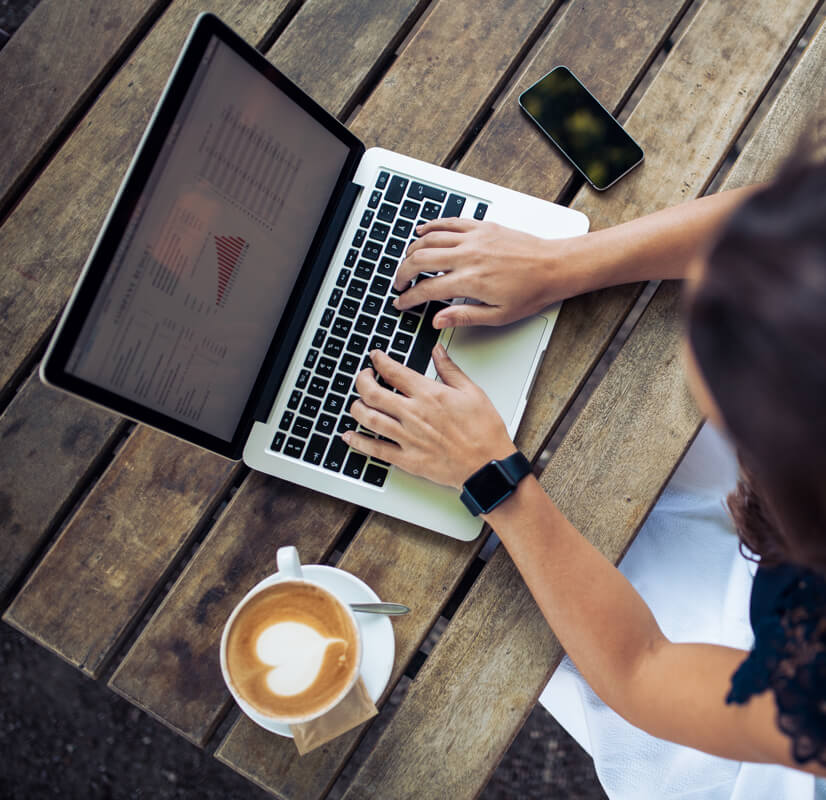 Coffee cup and laptop