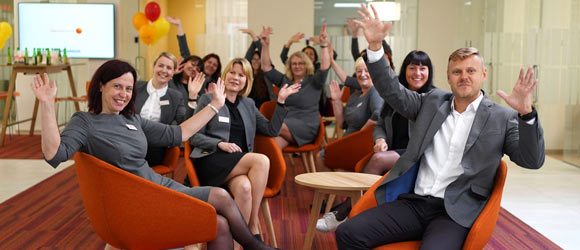 Employees of the Pärnu branch happily at the office.